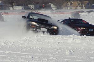 The Tim Stone / Dan Gervais / Ryan Rose Subaru Impreza hits the bank as Bonnie Stoehr / Jake Weber Mitsubishi Eclipse passes.