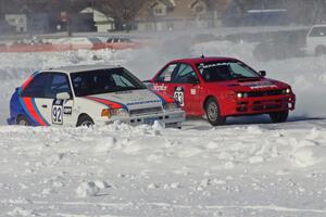 Chris Orr / Terry Orr Mazda 323GTX and Mark Utecht / Tom Fuehrer Subaru Impreza go side by side into turn two.