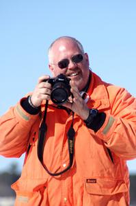 Jim Anderson takes a break from pulling cars out of the bank.