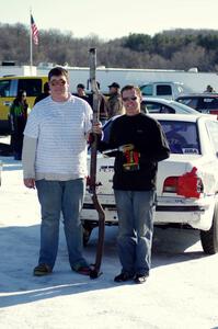 Kevin Beck and Brent Carlson pose with the exhaust from their Subaru Impreza.