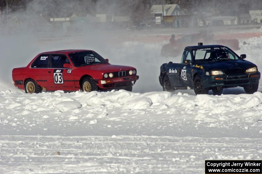 Pete Tavenier / Bruce Powell BMW 318i and Leo Nesseth's Subaru Impreza Wagon in turn one.