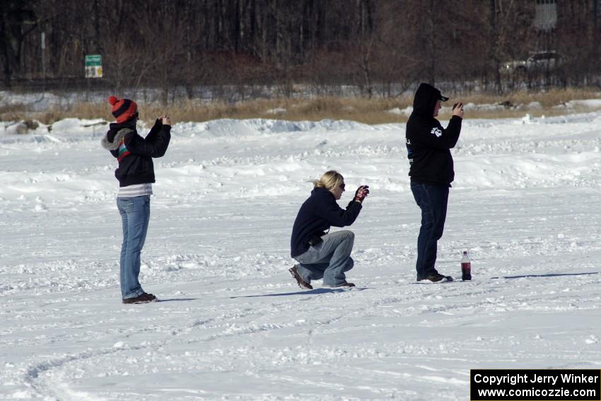 Bonnie Stoehr (in the middle) and friends take photos during the solo race.