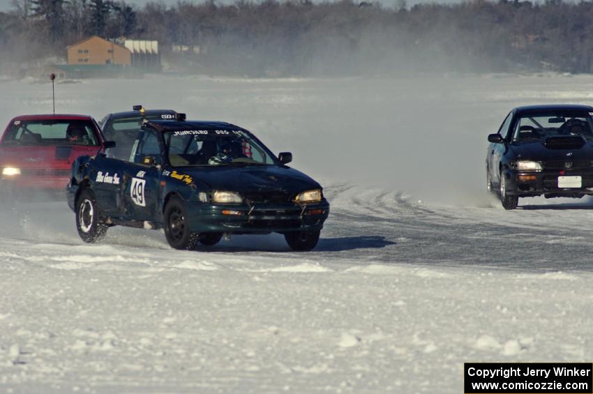 Four cars head into turn one.