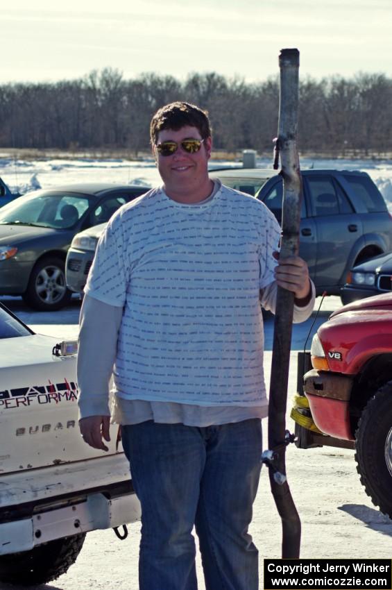 Kevin Beck poses with the exhaust from his Subaru Impreza.