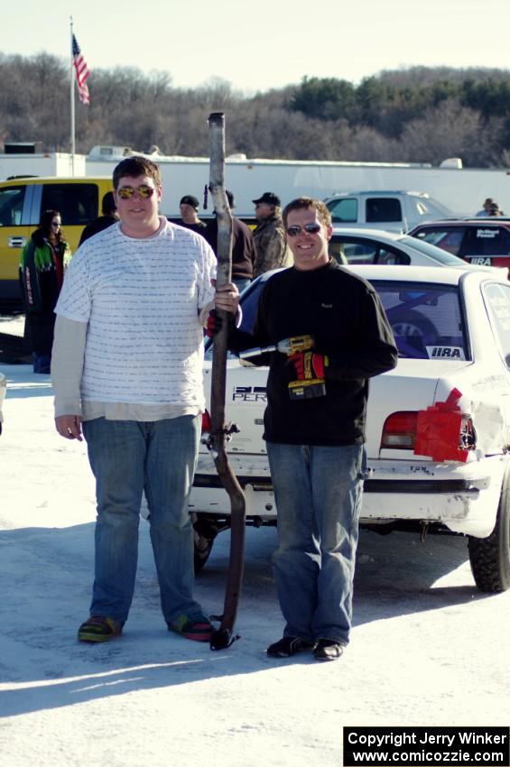 Kevin Beck and Brent Carlson pose with the exhaust from their Subaru Impreza.
