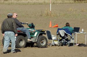 Kerry Freund, Mark Utecht and Carrie Carlson spotting cones during runs.