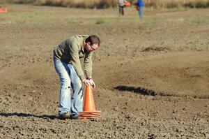 Tim Anderson helps stack the cones at the close of the racing day.