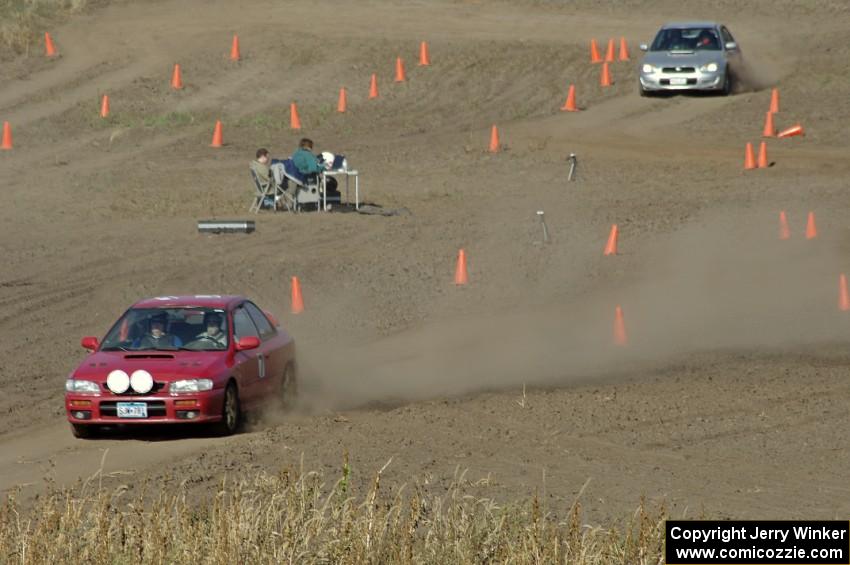 Kerry Freund's SA Subaru Impreza 2.5RS finishes as Jacob Kohler's SA Subaru WRX starts the course