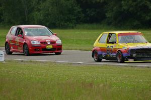 Jimmy Griggs's GTL VW Rabbit leads Steve Hendricks's SSC VW Rabbit into corner 6.