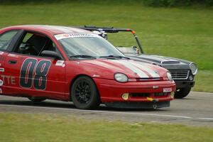 Zane Emstad's F Production Datsun SPL311 ducks inside Aaron Jongbloedt's ITA Dodge Neon ACR