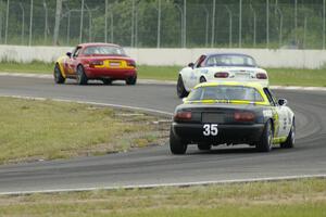 Greg Youngdahl leads Jack Randall and Dan Corgard all in Spec Miata Mazda Miatas.