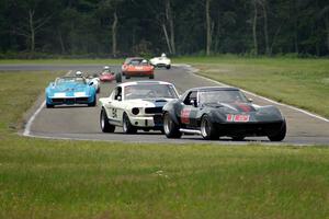 Vintage cars head into turn 4.