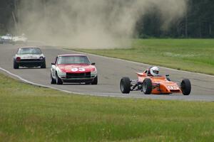 Rich Stadther's Merlyn Mk. 25 FF leads the 240Zs of Jerry Dulski and Mark Atkinson into turn 4.