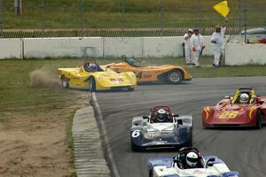 Dave Watson (83) and Matt Gray (64) spin off at turn 13 during the Spec Racer Ford race.