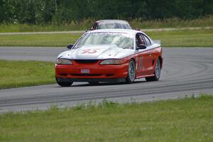 Tom Fuehrer's STO Ford Mustang battles the ITR Porsche 911 of Shannon Ivey