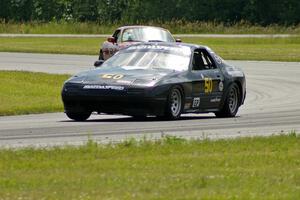 Dave Smith's E Production Mazda RX-7 and Greg Youngdahl's Spec Miata Mazda Miata