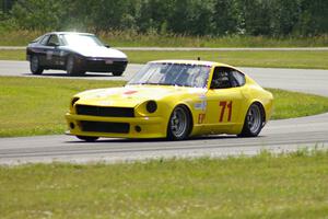 Tim Homes's E Production Datsun 280Z and Randy Van de Loo's ITS Porsche 944