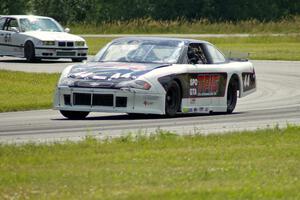John Cottrell's SPO Chevy Monte Carlo and Rick Iverson's ITE BMW M3