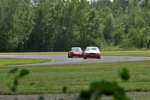 Tom Fuehrer's STO Ford Mustang battles the ITR Porsche 911 of Shannon Ivey