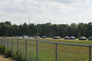 Dan Corgard's Spec Miata Mazda Miata spins off in turn 3.