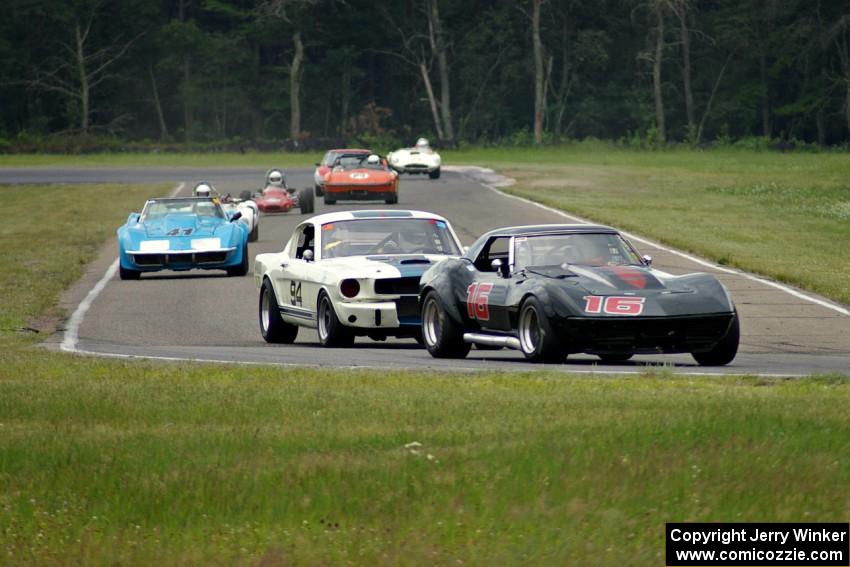 Vintage cars head into turn 4.