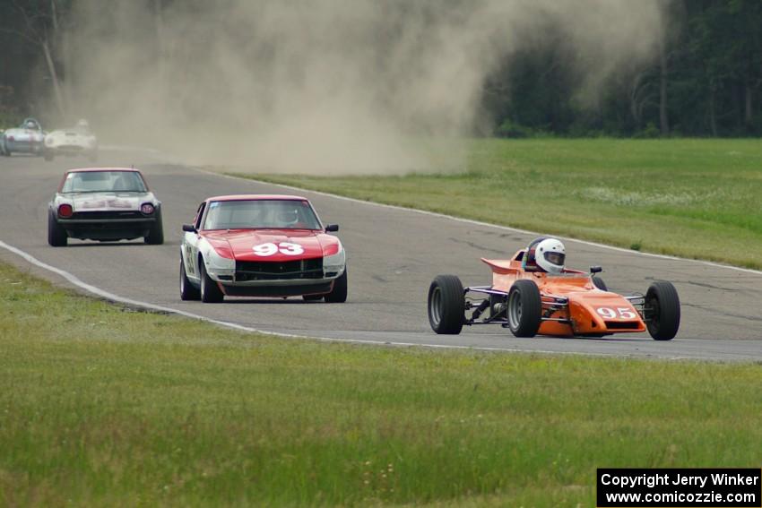 Rich Stadther's Merlyn Mk. 25 FF leads the 240Zs of Jerry Dulski and Mark Atkinson into turn 4.