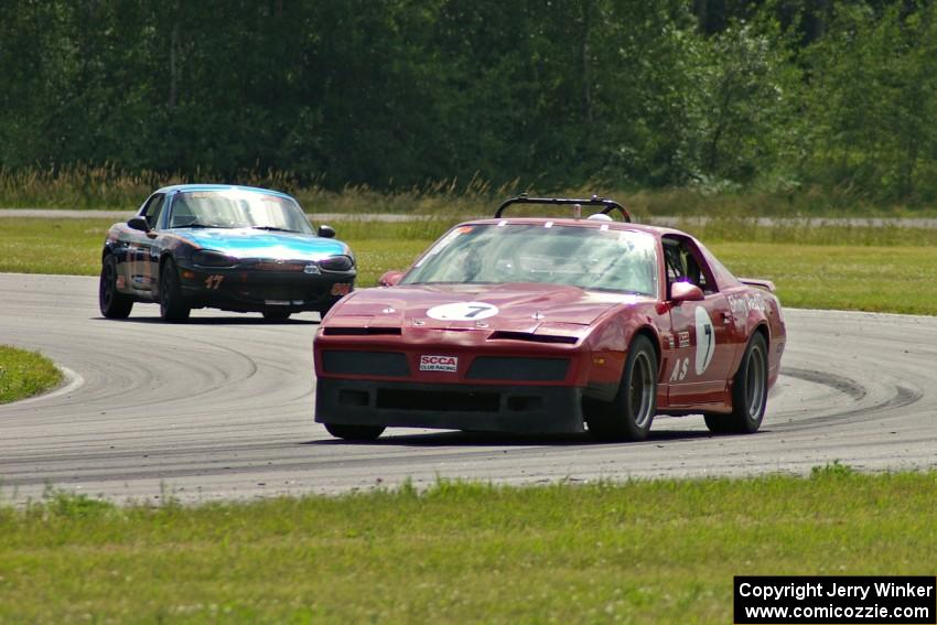 Tom Koetter's American Sedan Pontiac Firebird and Bruce Andersen II's Spec Miata Mazda Miata