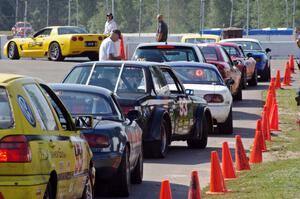 Group 1 cars lined up on the false grid before the start of the race