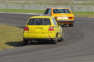 Tom Daly's ITC VW Scirocco leads Brent Carlson's ITJ VW Golf through corner 4