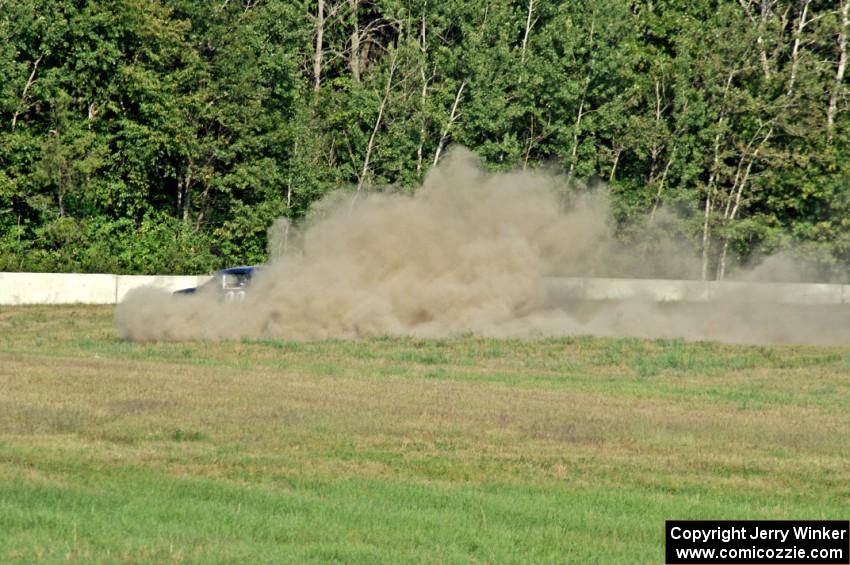 Daniel Juliano spins his ITA Mazda Miata at turn 5