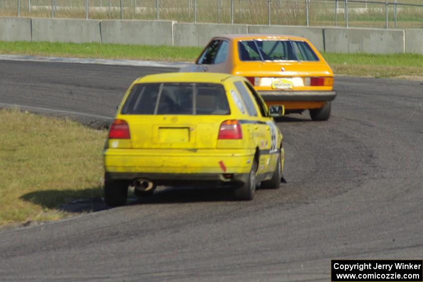 Tom Daly's ITC VW Scirocco leads Brent Carlson's ITJ VW Golf through corner 4