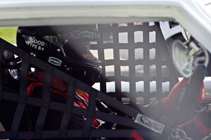 Shannon Ivey sits in his Chevy Camaro