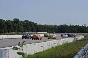 Race group 1 comes down the front straight into turn one.