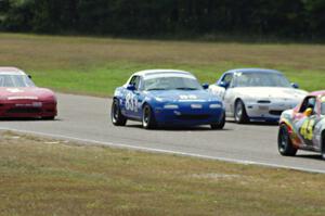 Tracy Ramsey, Lon Blaser and Samantha Silver battle in their Spec Miata Mazda Miatas