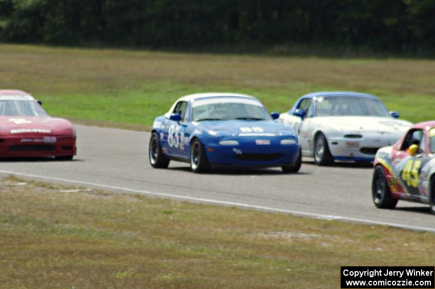 Tracy Ramsey, Lon Blaser and Samantha Silver battle in their Spec Miata Mazda Miatas