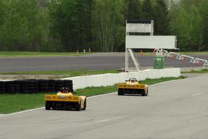 Matt Gray chases Tim Gray down the front straight, both in Spec Racer Fords
