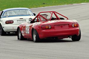 Jon Brakke's E Production Mazda Miata chases Samantha Silver's Spec Miata Mazda Miata