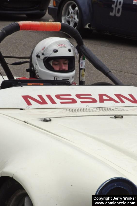 Bill Wessel sits in his F Production Datsun SPL311