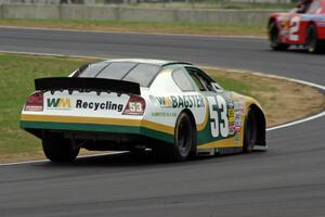 Andrew Ranger's Dodge Charger chases after Carl Harr's Chevy Impala