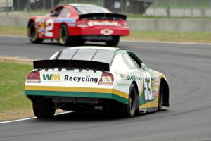 Andrew Ranger's Dodge Charger chases after Carl Harr's Chevy Impala