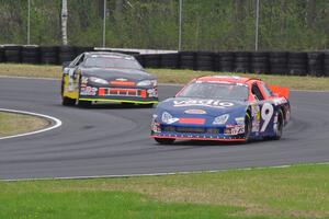 Dylan Lupton's Ford Fusion ahead of Dylan Hutchison's Chevy Impala