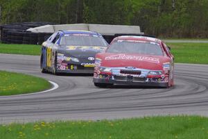 Dale Quarterley's Ford Fusion and Giles Thornton's Toyota Camry