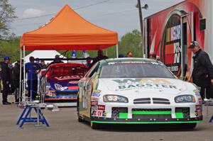 Andrew Ranger's Dodge Charger and Dylan Lupton's Ford Fusion go through the tech line