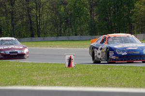 Derek Thorn's Ford Fusion ahead of Cameron Hayley's Ford Fusion