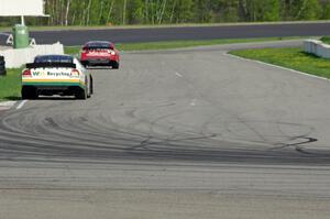 Andrew Ranger's Dodge Charger chases Dale Quarterley's Ford Fusion out of turn 13.