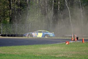 John Wood's Toyota Camry spins off at the carousel.