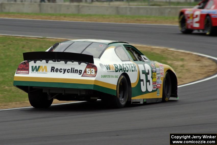 Andrew Ranger's Dodge Charger chases after Carl Harr's Chevy Impala