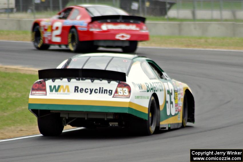 Andrew Ranger's Dodge Charger chases after Carl Harr's Chevy Impala