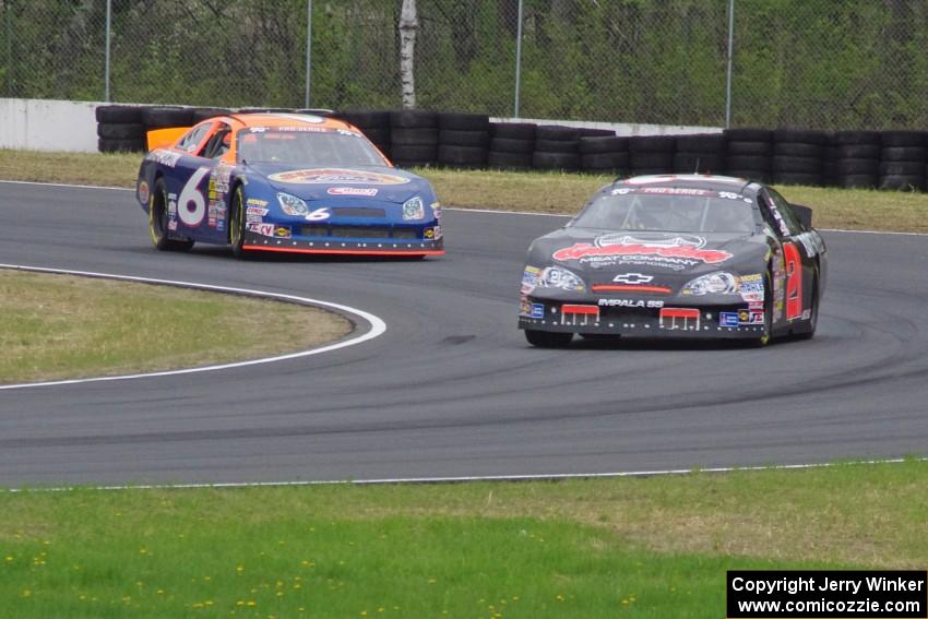 Michael Self's Chevy Impala ahead of Derek Thorn's Ford Fusion