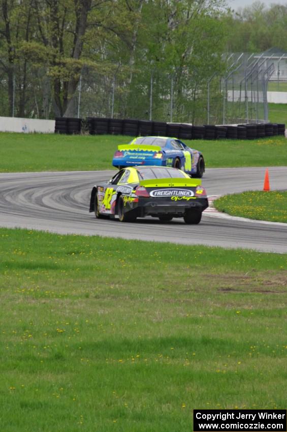 John Wood's Toyota Camry ahead of Taylor Cuzick's Ford Fusion